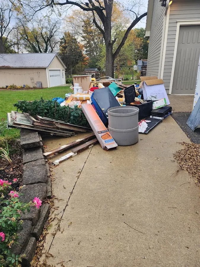 Dumpster being loaded with debris for Commercial Dumpster Rental in Ontario